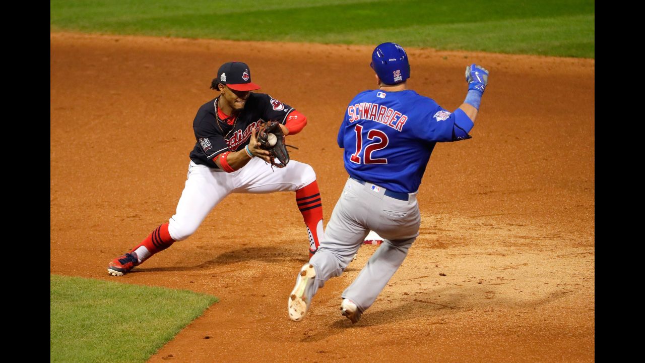 Francisco Lindor of the Indians tags out Kyle Schwarber of the Cubs during the third inning of Game 7.