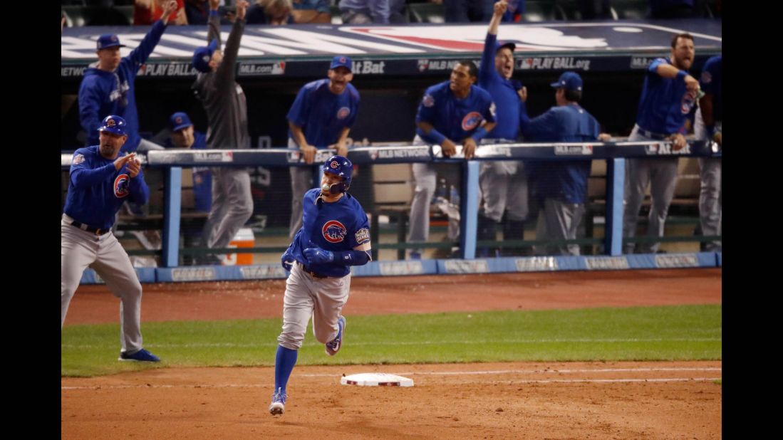 Javier Baez of the Cubs runs the bases after hitting a solo home run during the fifth inning in Game 7.