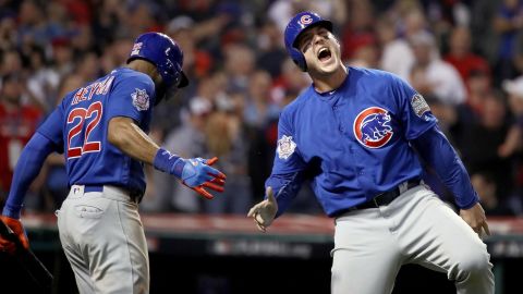 Anthony Rizzo of the Cubs celebrates with Jason Heyward after scoring a run in the tenth inning of Game 7.