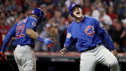 Anthony Rizzo of the Chicago Cubs celebrates with Jason Heyward after Rizzo scores a run in the 10th inning in Game Seven of the 2016 World Series.