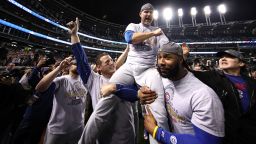 CLEVELAND, OH - NOVEMBER 02:  Anthony Rizzo #44, David Ross #3 and Jason Heyward #22 of the Chicago Cubs celebrate with actor John Cusack (R) after defeating the Cleveland Indians 8-7 in Game Seven of the 2016 World Series at Progressive Field on November 2, 2016 in Cleveland, Ohio. The Cubs win their first World Series in 108 years.  (Photo by Ezra Shaw/Getty Images)