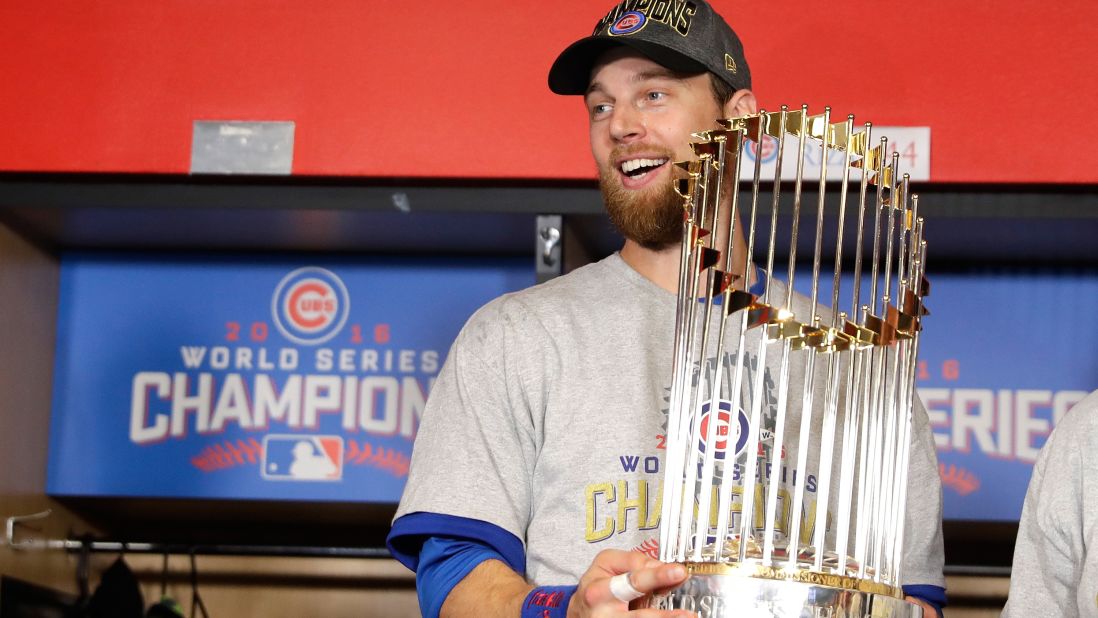 World Series MVP Ben Zobrist of the Cubs poses with The Commissioner's Trophy.