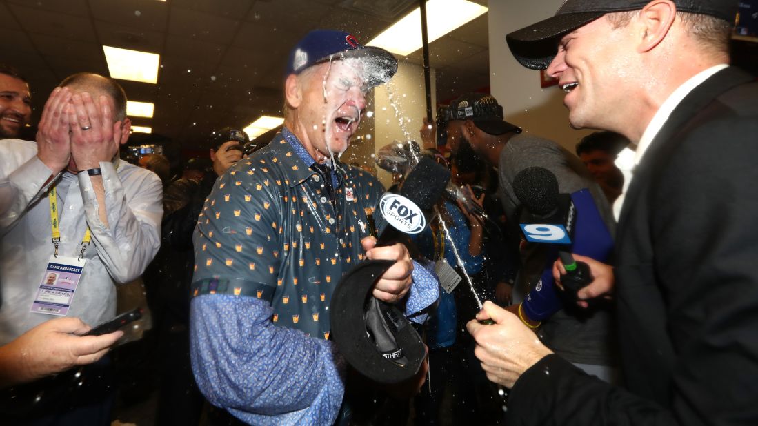 Actor Bill Murray, a longtime Cubs fan, celebrates in the winning clubhouse with Theo Epstein, the team's president of baseball operations.