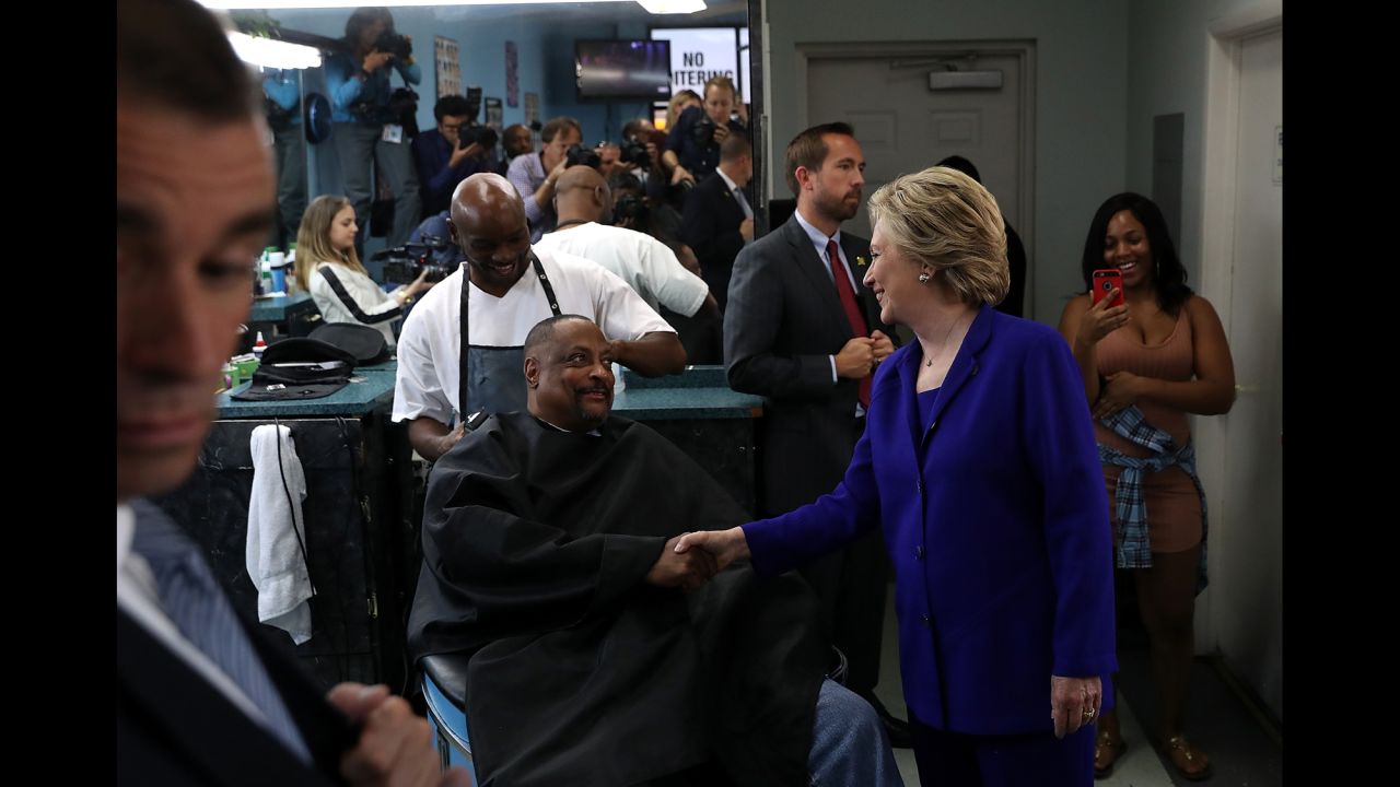 Clinton greets customers at a barbershop in North Las Vegas on November 2.