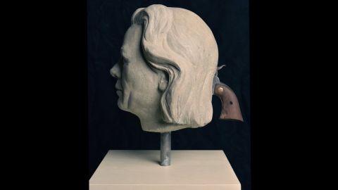 North Carolina-based artist Mel Chin created two classical portrait busts of a man and a woman, composites of infamous killers, with muzzles for eyes. "To lock eyes with these portraits is to stare straight into the dark barrels of guns." 