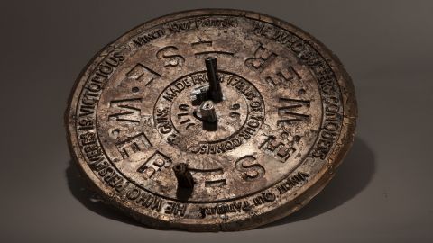 Bradley McCallum smelted guns and shell casings to create this manhole cover. Gun violence has been a regular feature of his work he said, as "our national policies have not changed, and even the most reasonable efforts to enact gun legislation face huge obstacles."