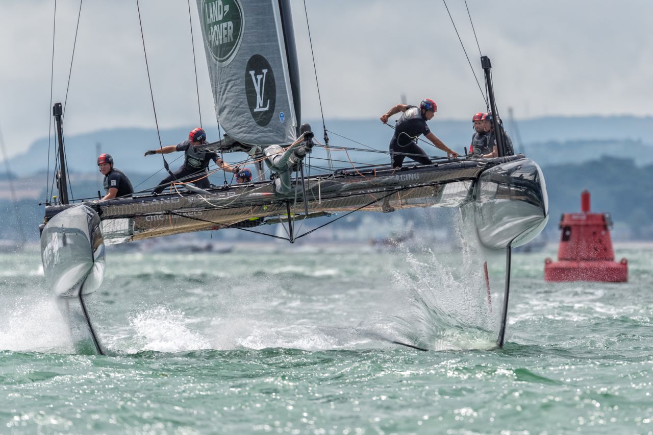 A foiling AC catamaran looks set for take-off during the LVAVWS Portsmouth event, with Sam Kurtul catching the moment head on.