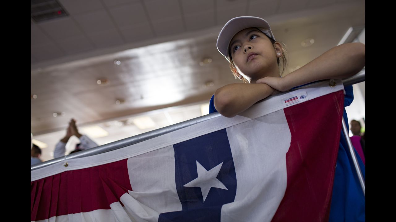 A young girl attends a Clinton rally in Las Vegas on Wednesday, November 2.