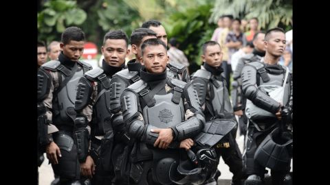 Indonesian riot police were on standby in the compound of the governor's office on November 4.