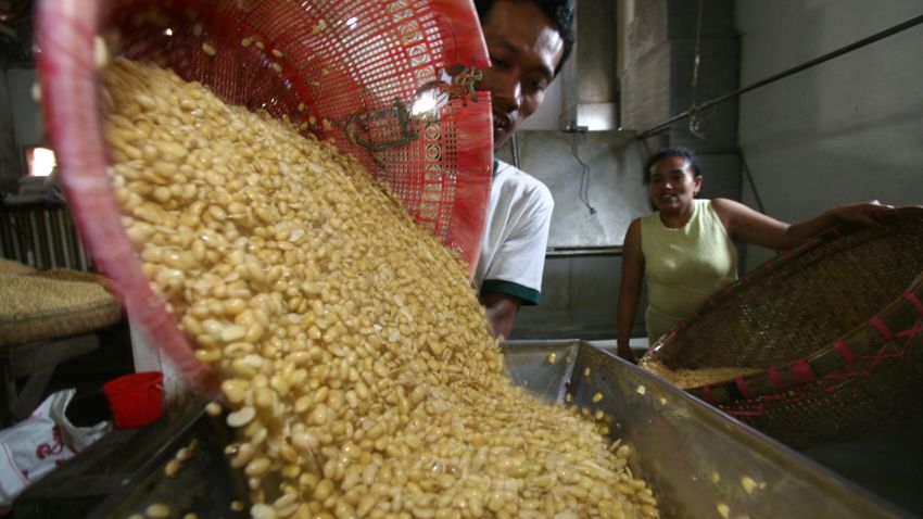 In this photograph taken on August 28, 2013, a worker processes imported soybeans from the US into a "tempe," at a factory in Malang in eastern Java island. Indonesia's trade deficit unexpectedly hit a record high in July, data showed on September 2, adding further pressure on policymakers to shore up the economy as investors flee the country as it faces an increasingly grim future.      AFP PHOTO / AMAN ROCHMAN        (Photo credit should read AMAN ROCHMAN/AFP/Getty Images)