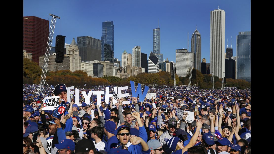 Chicago Cubs fans celebrate during a rally in Grant Park honoring the World Series champions Friday in Chicago. (AP Photo/Charles Rex Arbogast)