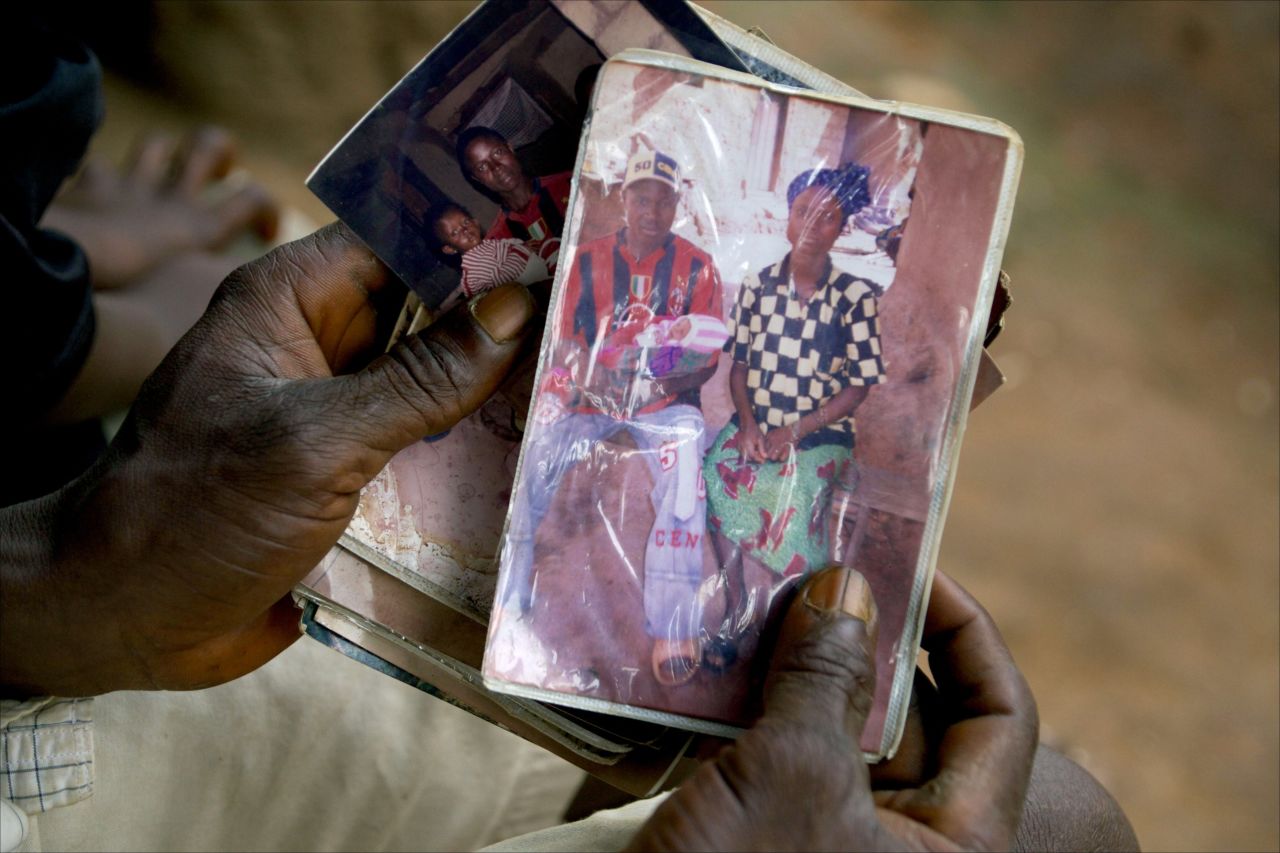 Emile Ouamouno, a 2-year-old boy in the southern Guinea village of Meliandou, was identified as "patient zero" in the Ebola outbreak circa 2014. Emile died of the disease, as did several of his family members. Emile's father, Etienne Ouamouno, holds a picture of his second wife, Sia Dembadouno, and Emile.