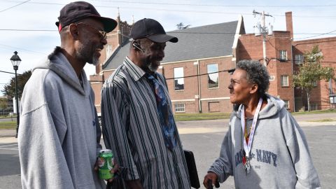 From left, Howard Robinson, Muhamad As-saddique Abdul-Rahman and Katrina Miller speak in the Blackwell neighborhood of Richmond, Virginia, on October 30, 2016.