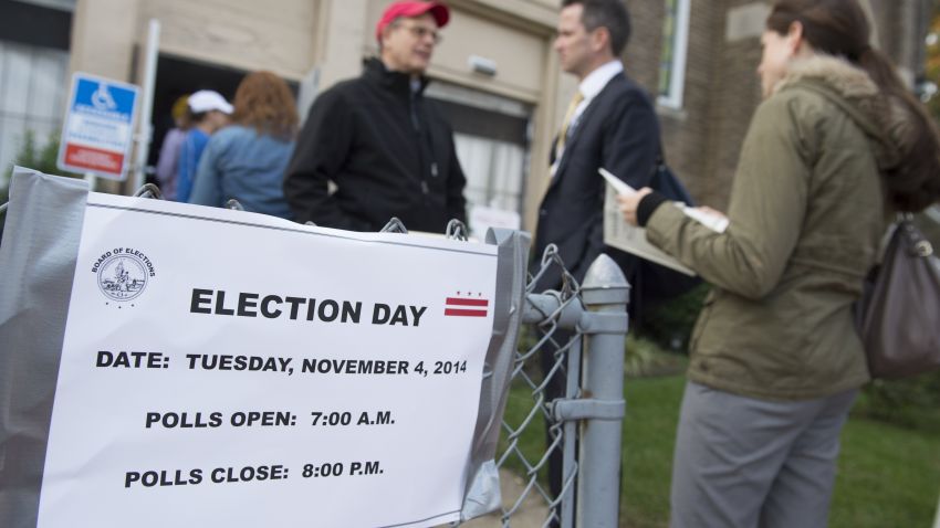 Voters line up to cast their ballots at a polling station in Washington, DC, November 4, 2014, during the midterm elections.  With Senate control on the line, US Democrats hope they don't get steamrolled by Republicans in Tuesday's midterms, but most signs point toward President Barack Obama's party suffering crippling election setbacks. Recent polls show Republicans pulling ahead in the battle for power in Washington despite races in Alaska, North Carolina and other states remaining very close, and they expressed confidence in the home stretch of one of the most pivotal midterm elections in years. AFP PHOTO / Saul LOEB        (Photo credit should read SAUL LOEB/AFP/Getty Images)