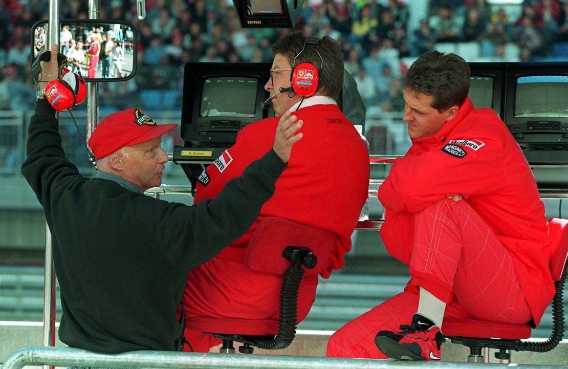 Ross Brawn (center), says he's not spoken to Niki Lauda (left) since he left Mercedes