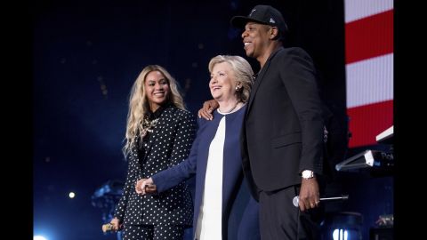 Clinton joins Beyonce and Jay Z on stage during a free concert in Cleveland on November 4.
