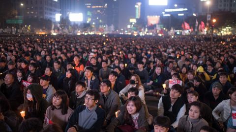 Demonstrators in Seoul call for the president's resignation Saturday.