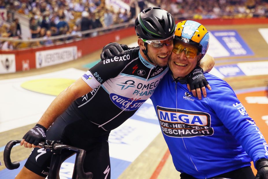 Mark Cavendish of Great Britain celebrates with Derny pacer Michel Vaarten after winning a race at the Ghent Six Day in 2014. 