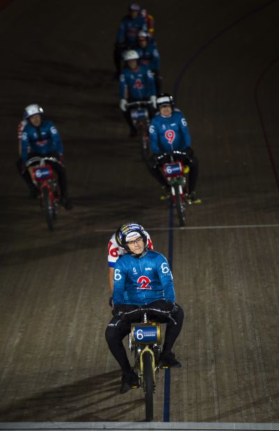 Riders, including Huybrechts (no 6), take part in a Derny race during the Six Day London event.