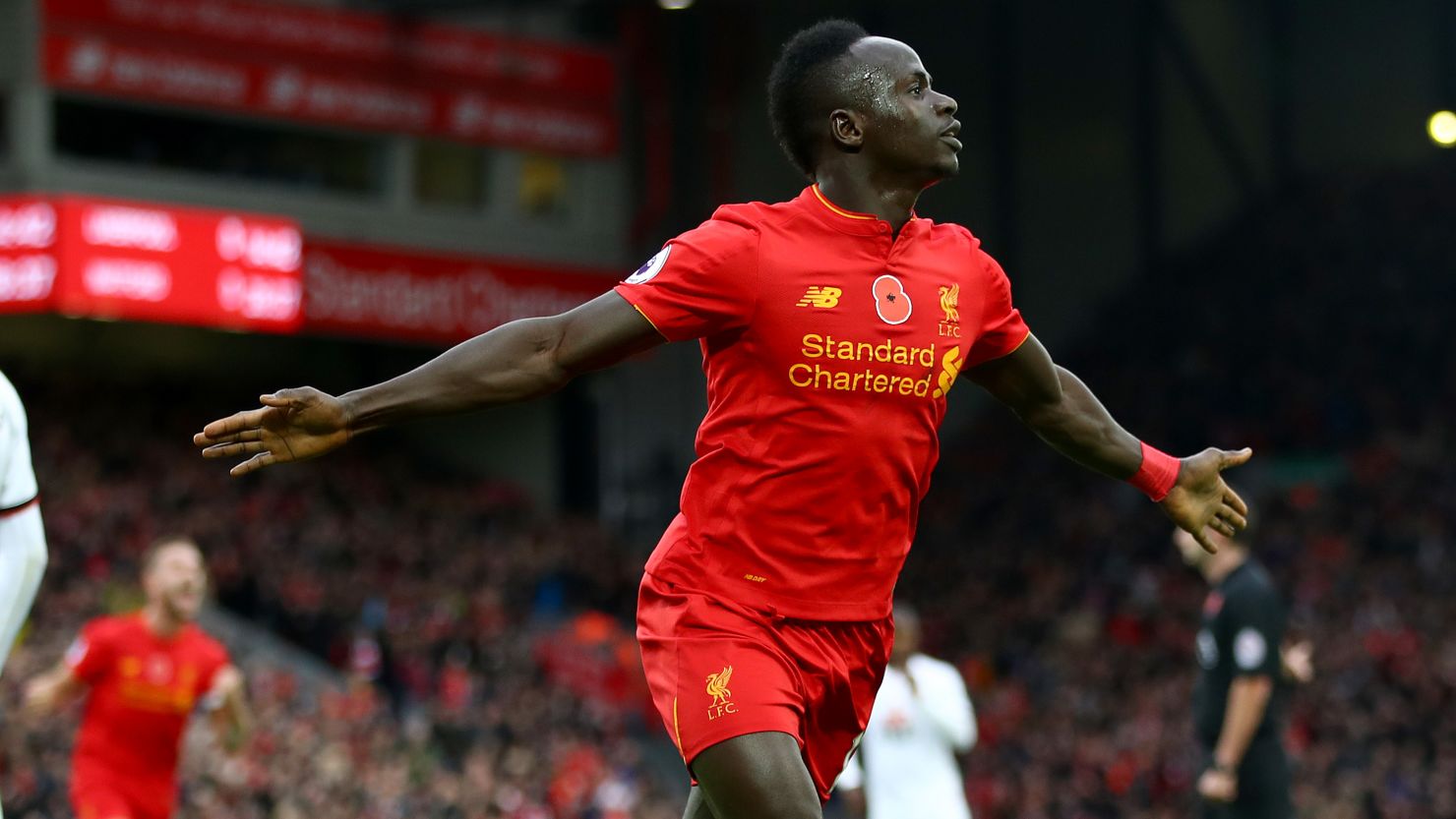 Sadio Mane of Liverpool celebrates scoring the opener against Watford as his team goes top of the English Premier League.