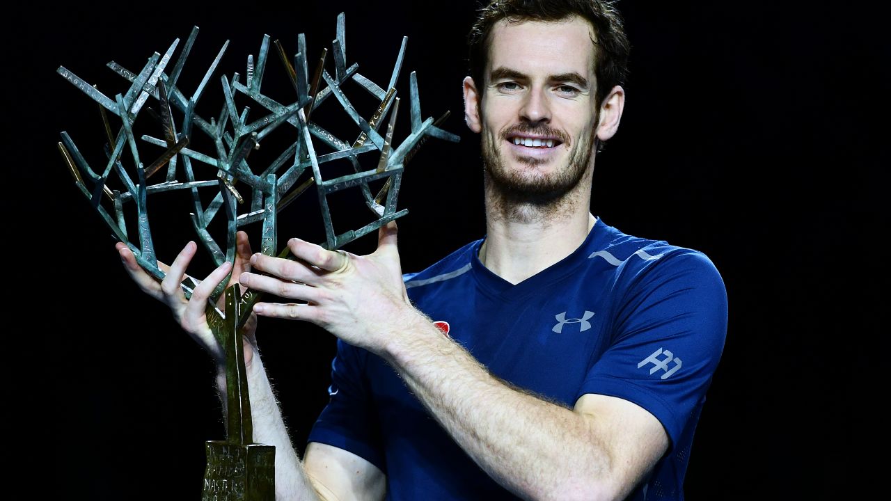 Andy Murray poses with 'Tree of Fanti' Trophy after winning the Paris Masters 1000 title with a final victory over John Isner.