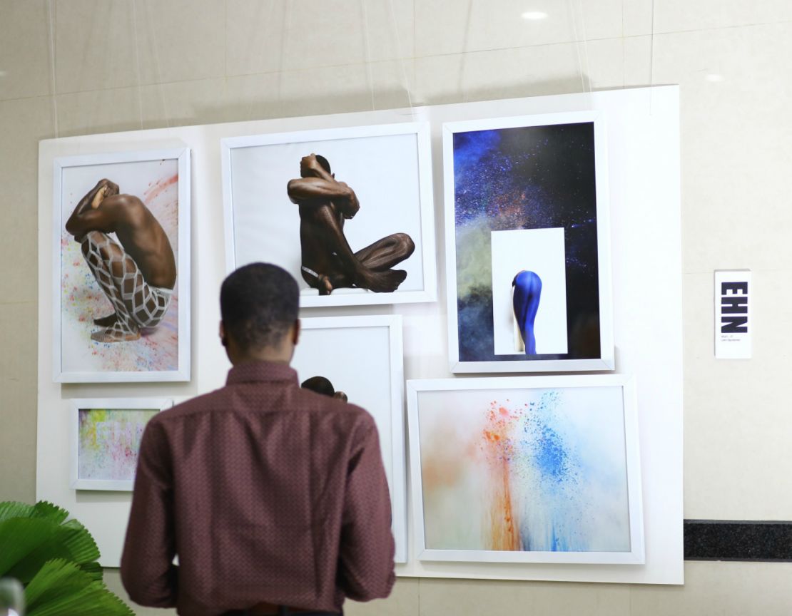 A visitor examines Nigerian fashion designer Maki Oh and artist Lakin Ogunbanwo's exhibition of  the Nigerian expression "ehn". The term can mean many things, here they explore it's use as a question - "ehn?" 
