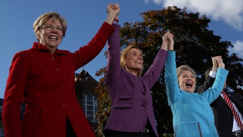 U.S. Sen Elizabeth Warren, New Hampshire Gov. Maggie Hassan and Hillary Clinton get in formation at an October campaign rally.