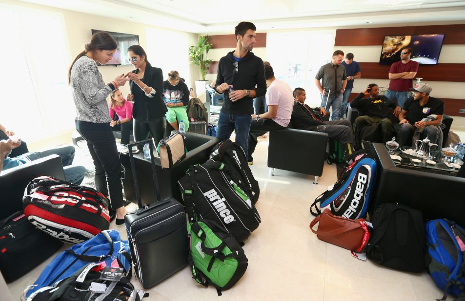 In the same lounge, Novak Djokovic is pictured surrounded by players' racket bags -- a sizable piece of cargo to lug around the world.