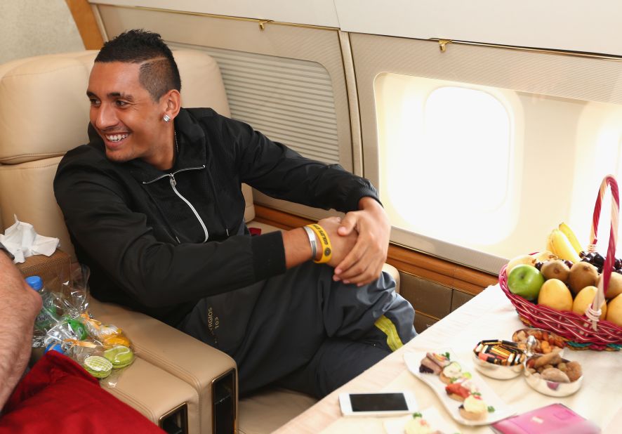 But it's not always economy class and long delays; players are also treated to private jets and five-star service. Here, Nick Kyrgios, a member of the Singapore Slammers, travels to Singapore prior to an International Premier Tennis League match in 2014.