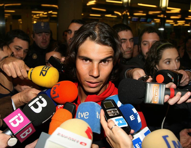 Negotiating your exit from international airports can be a tricky business ... Rafael Nadal is immediately bombarded by the press after touching down at Mallorca as the newly-crowned Australian Open champion in 2009.
