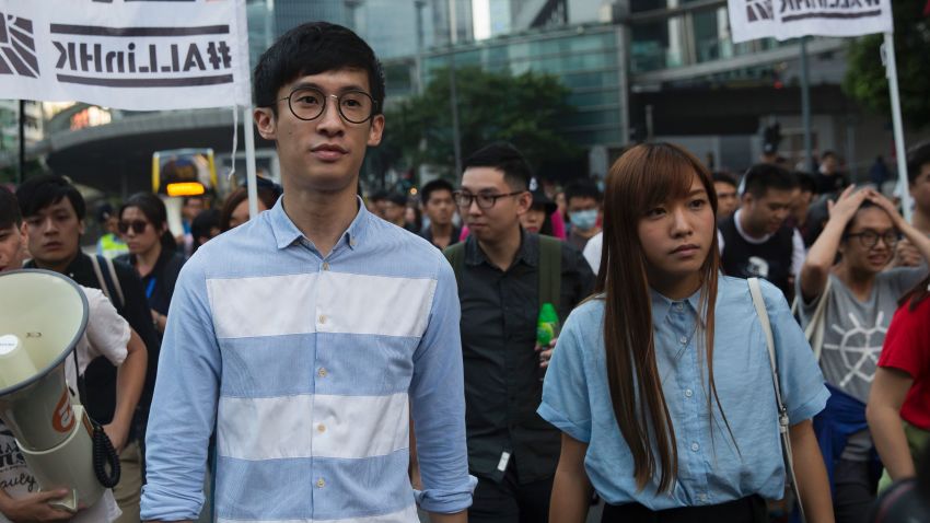 Baggio Leung (L) and Yau Wai-ching (R) of the Youngspirations organisation march during a protest in Hong Kong on November 6, 2016.
Hong Kong police used pepper spray November 6 to drive back hundreds of protesters angry at China's decision to intervene in a row over whether two pro-independence lawmakers should be barred from the city's legislature. In chaotic scenes reminiscent of mass pro-democracy protests in 2014, demonstrators charged metal fences set up by police outside China's liaison office in the semi-autonomous city. / AFP / ISAAC LAWRENCE        (Photo credit should read ISAAC LAWRENCE/AFP/Getty Images)