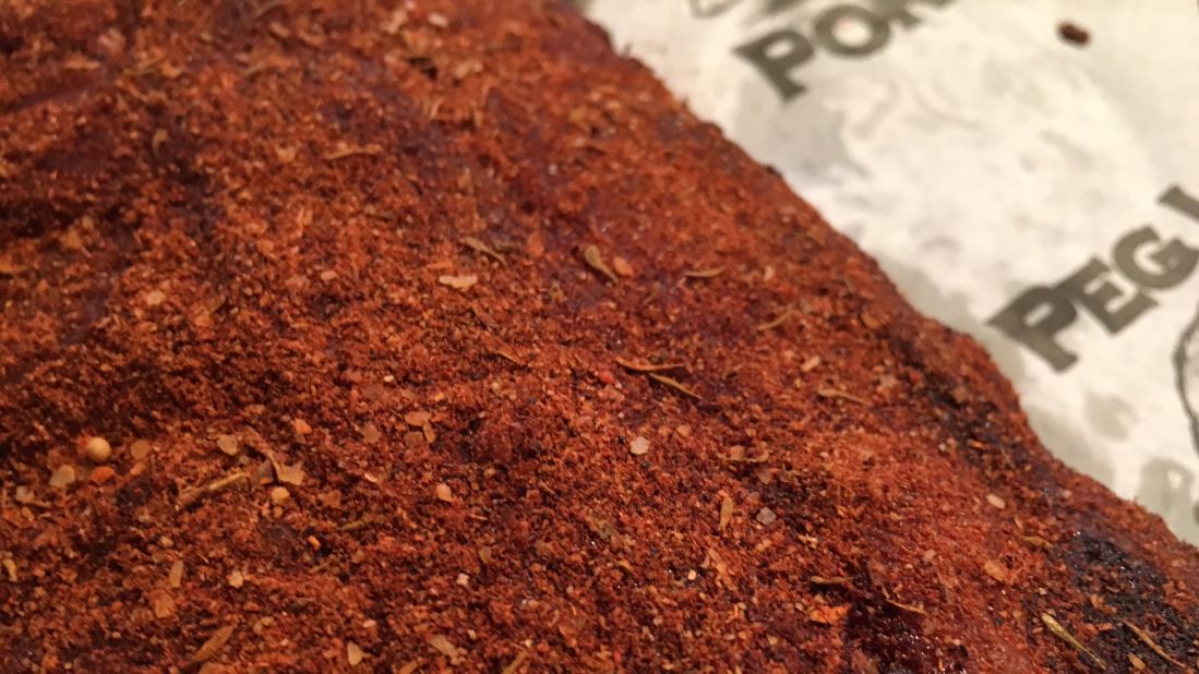 These dry rub ribs at Peg Leg Porker in Nashville are cooked already, somewhere under that dry rub. 