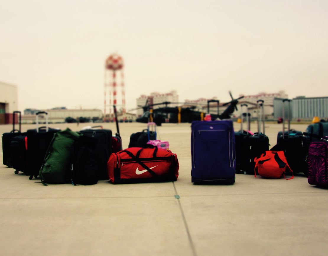 Bags sit on the runway in South Korea. Families have to carry food and water with them as well as personal items. 