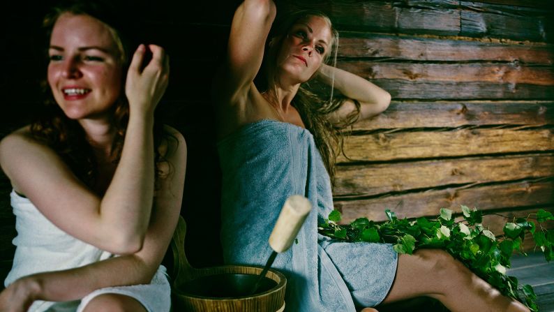 A traditional Finnish sauna is made of pinewood and is dimly lit. Sauna-goers should sit on their towels; naked skin shouldn't touch the wood. 