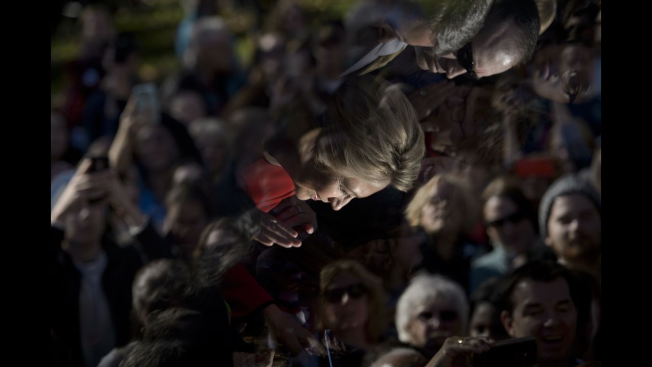 Clinton's image is reflected in a teleprompter as she greets supporters after a rally in Pittsburgh on November 7.