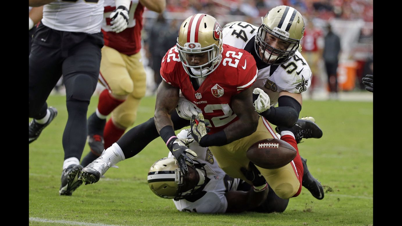 San Francisco running back Mike Davis fumbles near the goal line during an NFL game against New Orleans on Sunday, November 6.