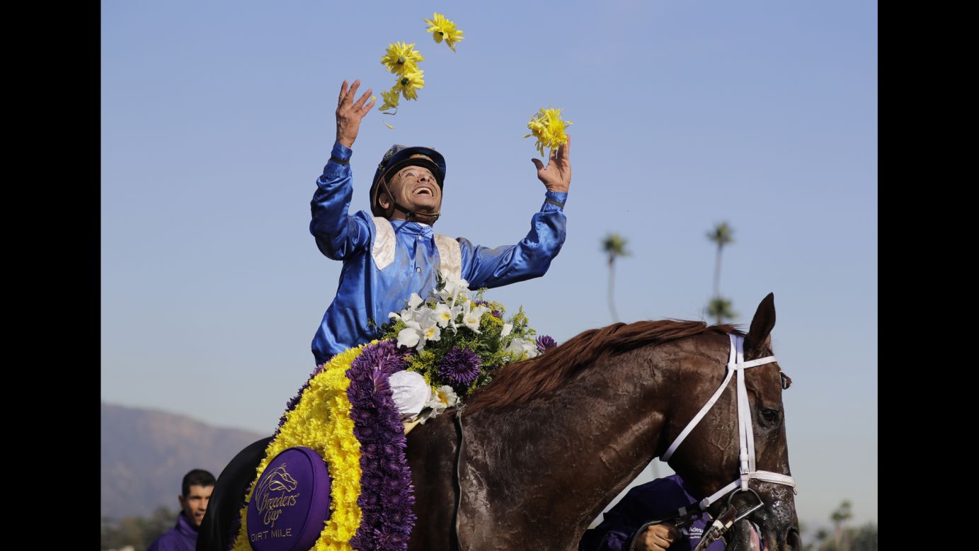 Jockey Mike Smith celebrates Friday, November 4, after he rode Tamarkuz to victory in the Breeders' Cup Dirt Mile race in Arcadia, California.