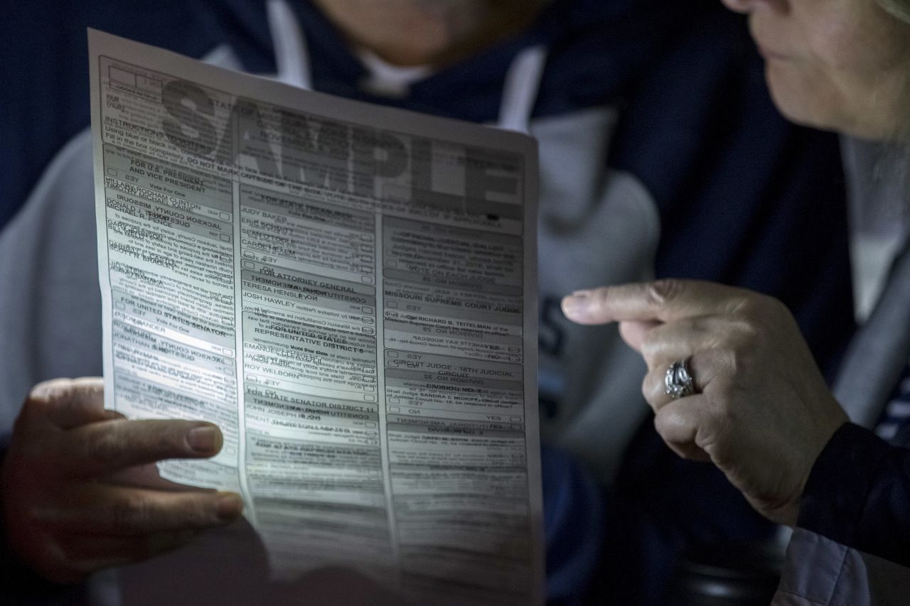 Voters look at a sample ballot at a polling location in Independence, Missouri.