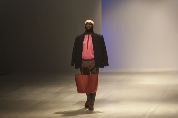 "We're trying to start a conversation, we're getting a foot in the door. People have to see plus fashion in a way they never have before."<br />Pictured: A male model shows off some of the new collection from ÀSSIÀN by fashion designer Matiu Gordun. Photo: Stefan Heunis/AFP/Getty Images