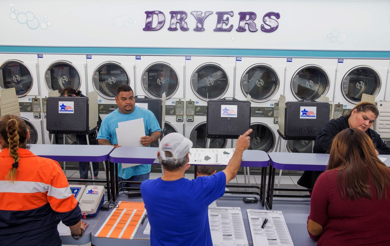 Voters cast their ballots at a Chicago laundromat on November 8.