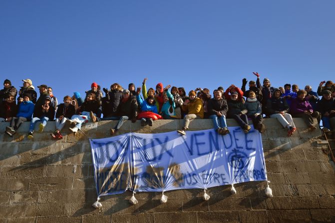 Spectators gather by the port at Les Sables-d'Olonne to farewell the competitors. 