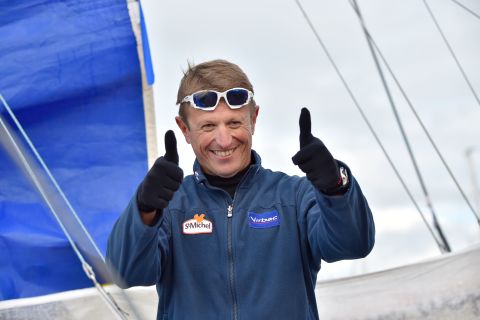 French skipper Jean-Pierre Dick thanks the crowd lining the shore for their support before setting off.