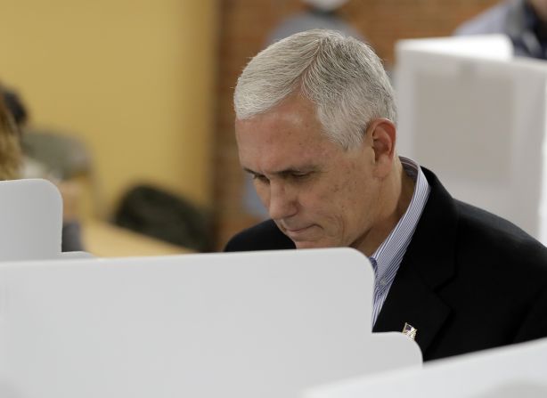 Trump's running mate, Indiana Gov. Mike Pence, votes in Indianapolis.