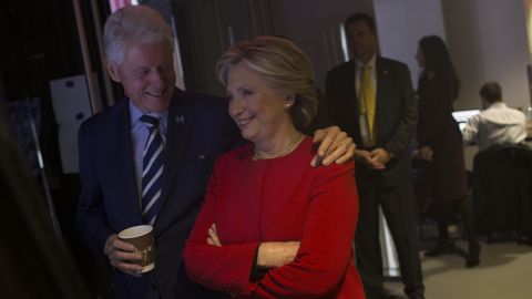 The Clintons share a moment backstage.