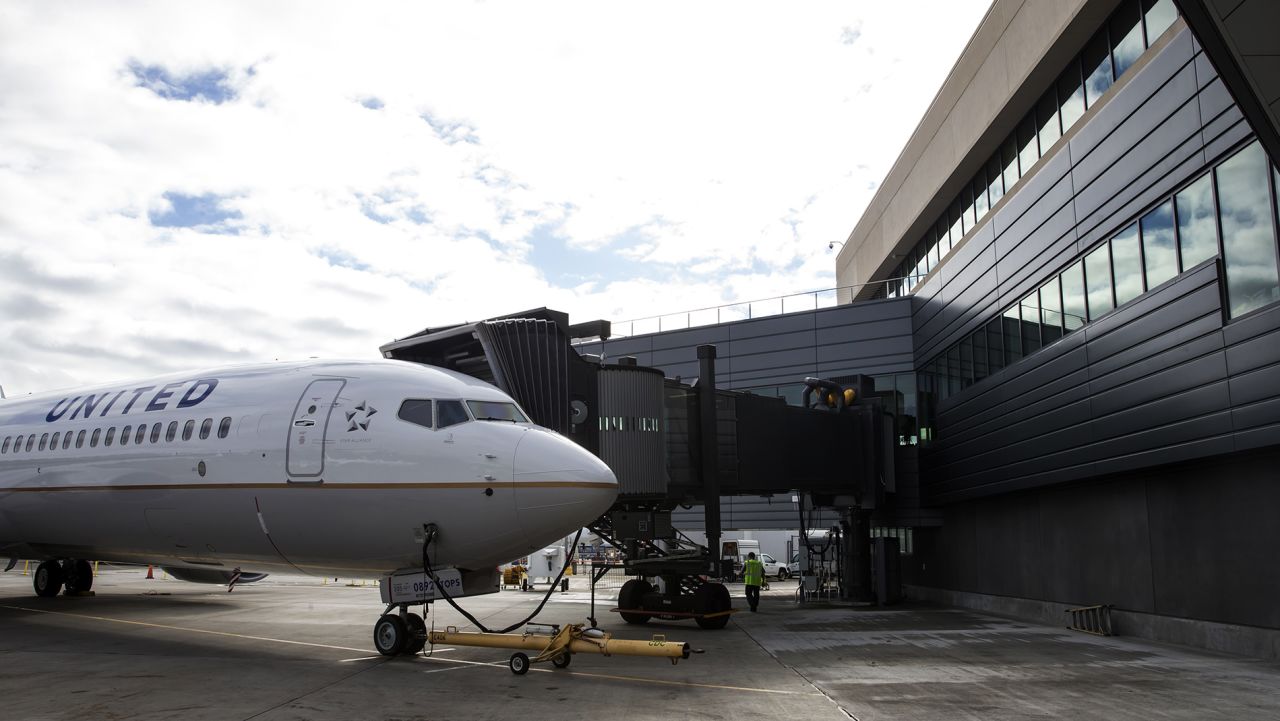 SEATTLE, WA - OCTOBER 19: An United Airlines Boeing 737 is parked out front of the new Boeing 737 Delivery Center on October 19, 2015 in Seattle, Washington. The larger facility will better accommodate the increased 737 production rates. (Photo by Stephen Brashear/Getty Images)