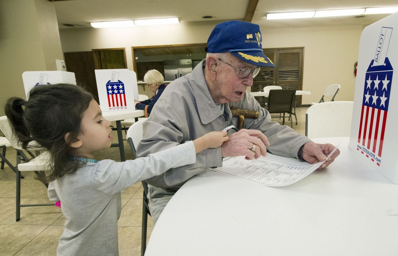 Harvey Erwin, a 94-year-old World War II veteran, votes with his 3-year old great-granddaughter in Joplin, Missouri. Fellow voters <a href="http://www.cnn.com/2016/11/08/politics/wwii-vet-cheered-at-polls-trnd/index.html" target="_blank">applauded Erwin</a> as he walked to the front of the voting line. "People turned and started clapping all the way to the front of line and saying 'Thank you for your service,' " his daughter, Janine Erwin Johnson, told CNN. "It made tears stream down my face because of the recognition to my sweet dad."