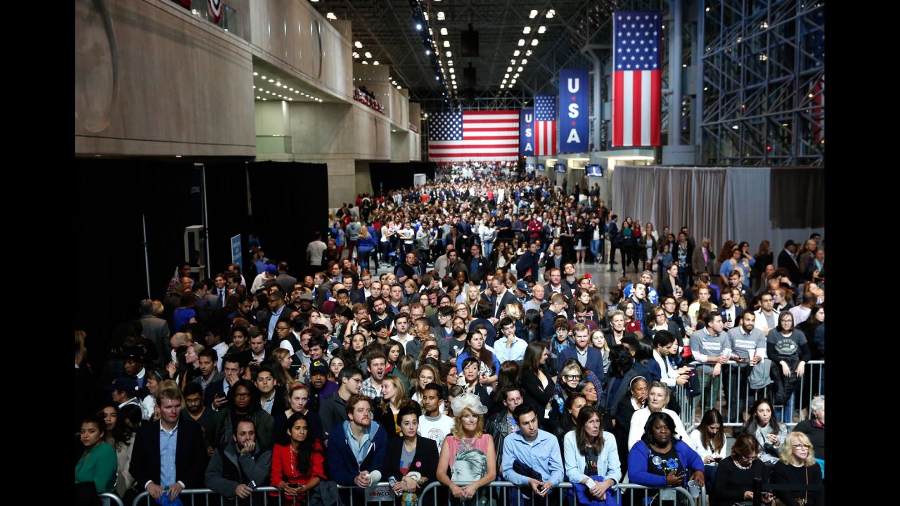 People watch voting results at the Javits Center in New York.