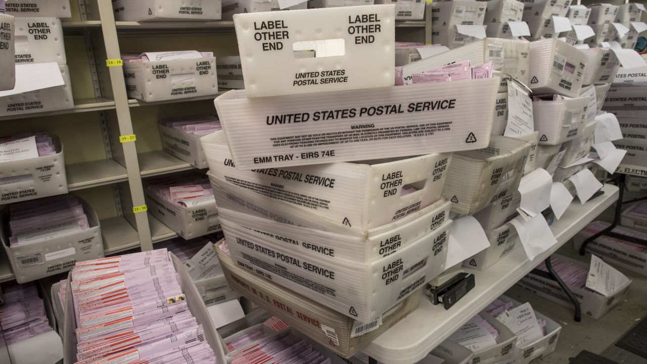 Boxes containing mail-in ballots sit waiting to be sorted at the San Francisco City Hall polling location.