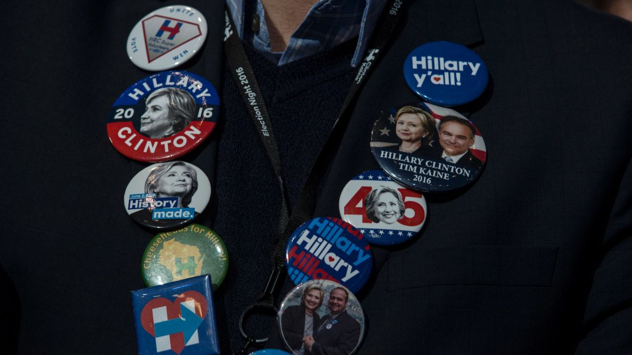 Buttons decorate a Clinton supporter at the Javits Center.