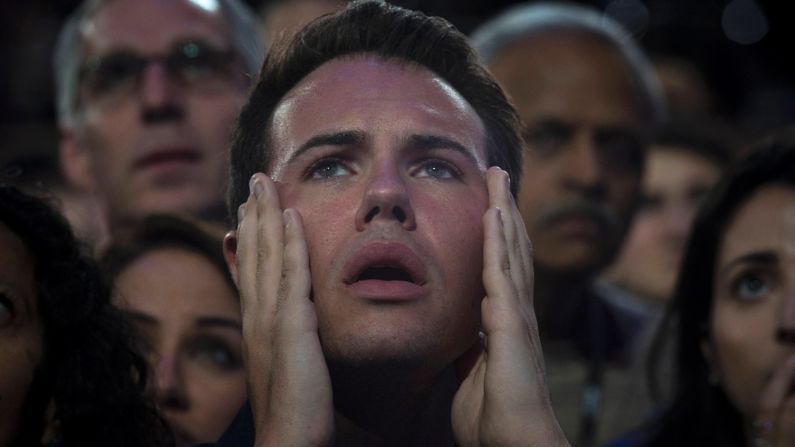 A man reacts as he watches voting results at the Javits Center.